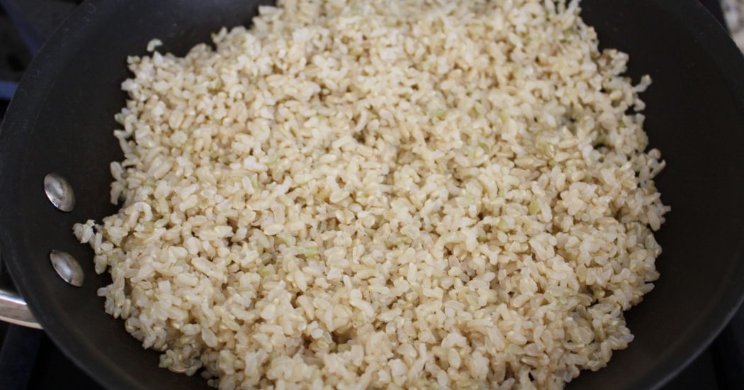 Add the rice to the skillet in an even layer