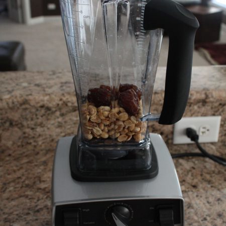 Place dates and peanuts in a blender or food processor