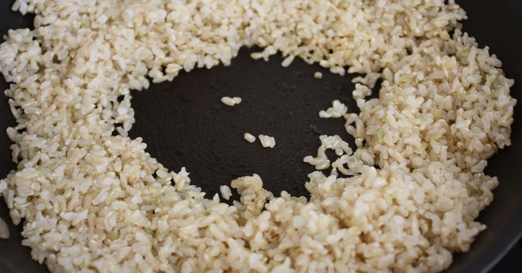 Use a wooden spoon and gently push the rice away from the center